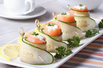cucumber rolls with salmon, cream cheese closeup horizontal - Powered by Adobe