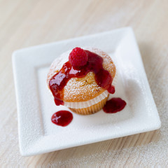 Muffin with raspberry juice
