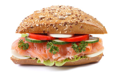 sandwich with salmon and vegetables closeup isolated front