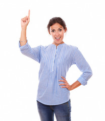 Hispanic lady pointing up while standing