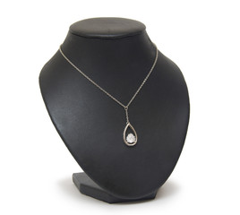 Diamond necklace on black mannequin isolated on white background