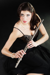 Art. Woman flutist flautist with flute. Music.
