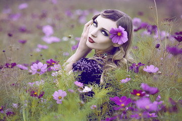Beautiful woman in a flower field