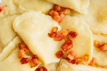 Closeup dumplings sprinkled with pork scratchings 