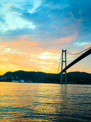 sunset over suspension bridge in Bergen, Norway