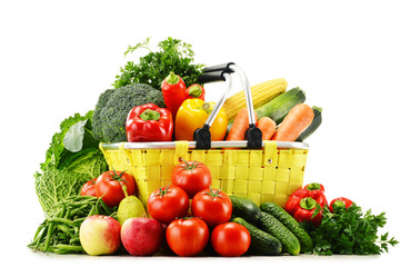 Shopping basket with groceries isolated on white