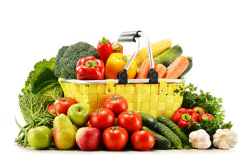 Shopping basket with groceries isolated on white