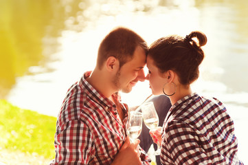 happy young couple enjoying picnic. Toned image