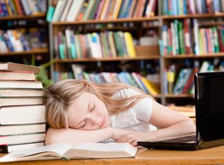 pretty female student sleep in library