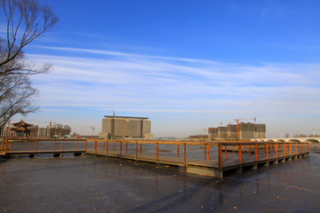 Fototapeta premium river scenery in a park in winter