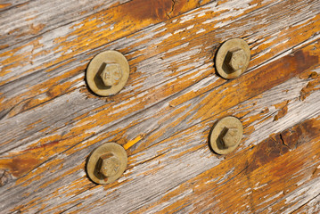 Wooden texture with bolts