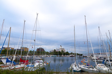Fototapeta na wymiar Docking yachts against the grey skies.
