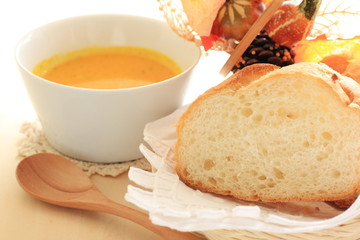 Homemade pumpkin soup with french bread