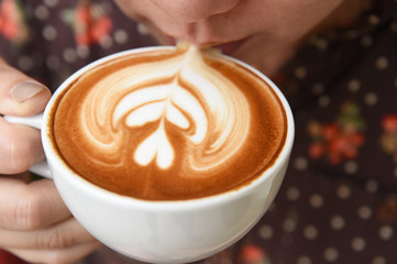 a cup of latte art coffee