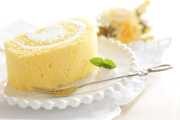 Swiss roll on dish with mint