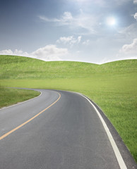 Road through the meadow and hillside.