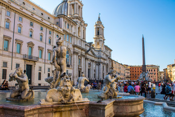 Naklejka na ściany i meble Tourist in Navona square near the Moor Fountain , in Rome, Italy