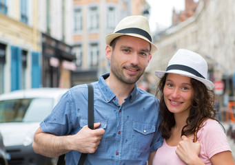 Fototapeta na wymiar Young couple visiting city during holidays
