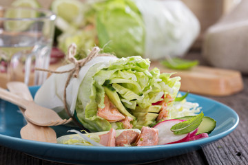 Salad with poached salmon and vegetables