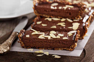Fototapeta na wymiar Vegan chocolate tart with almonds