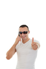 Naklejka premium Man With Sunglasses in white t-shirt Answering Smart Phone and s