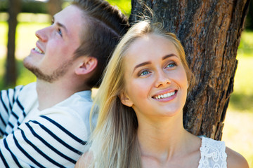 Couple resting under a tree