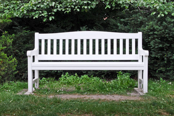 A white garden bench