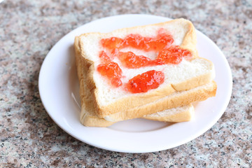 Bread with strawberry jam.