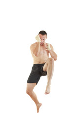 Fototapeta na wymiar athletic fighter with bandages on hands jumping
