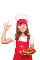 happy little girl cook with spaghetti and ok hand sign