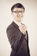 Successful young business man of Asian, full length portrait iso