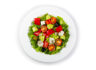 Plate with fresh greek salad isolated