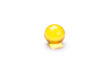 Vitamin A capsule, isolated on white. Healthcare concept.