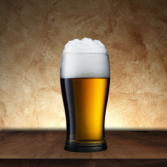 Glass of beer on wood table