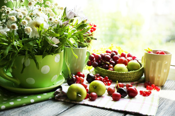 Still life with berries and flowers