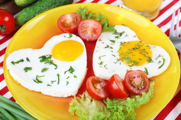 Scrambled eggs with vegetables and juice served in plate