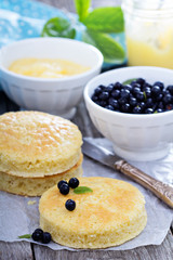 Making a cake, sponge layers, frosting and berries
