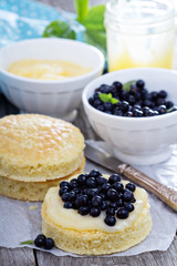 Making a cake, sponge layers, frosting and berries