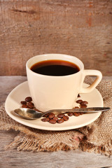 Cup of coffee on rustic wooden background