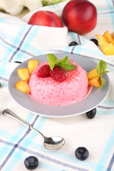 Heart shaped cake with fruits and berries on plate on