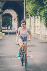young hipster woman with bike