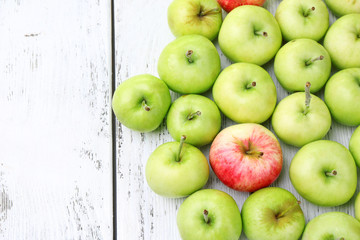 Ripe apples on wooden table close-up