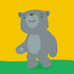 Toy bear walking on the grass