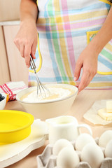 Baking tasty pie and ingredients for it on table in kitchen
