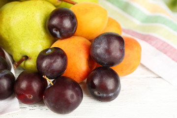 Ripe fruits on table close up