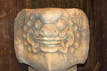 animal portrait in stone pillar in the Phoenix Town
