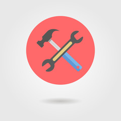 wrench and hammer in circle with shadow
