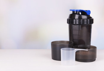 Whey protein powder and plastic shaker