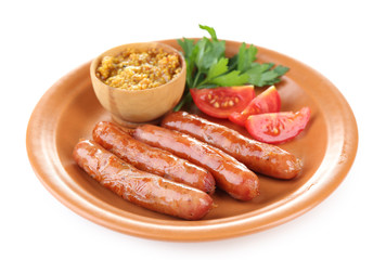 Tasty thin sausages on plate isolated on white