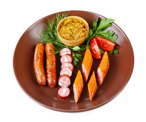 Assortment of tasty thin sausages on plate isolated on white